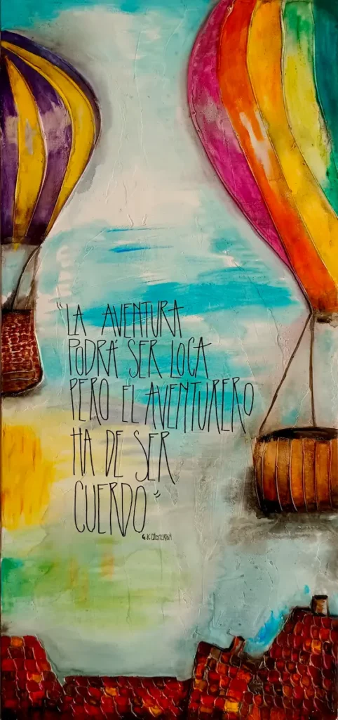 Cuadro artesanal con globos aerostáticos de colores y la frase “La aventura podrá ser loca, pero el aventurero ha de ser cuerdo
