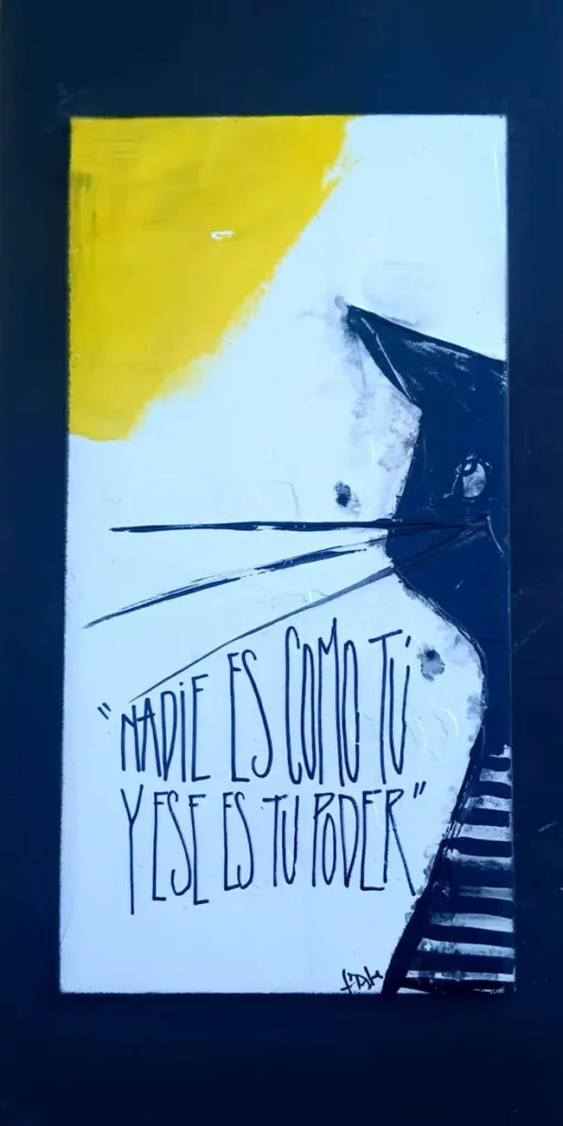 Cuadro artesanal con ilustración de gato y la frase “Nadie es como tú y ese es tu poder”, en estilo minimalista y expresivo.