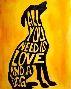 Pintura acrílica de la silueta de un perro en negro con el texto "All You Need Is Love and a Dog" integrado en la figura, sobre fondo amarillo, pintada a mano sobre tabla de DM.