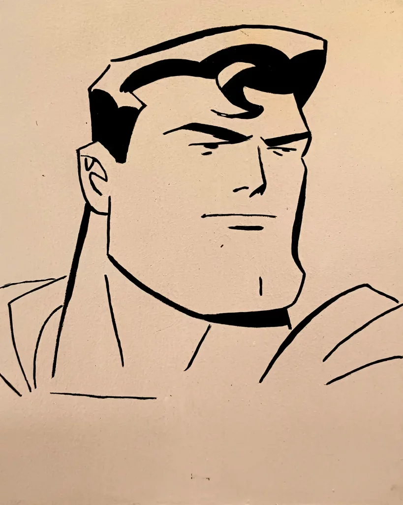 Ilustración en tinta negra del rostro de Superman estilo cómic clásico DC, con trazo limpio y expresión seria, pintada a mano sobre tabla de DM.