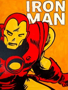 Iron Man en primer plano con brazo adelantado estilo cómic en rojo y amarillo Irreverentes