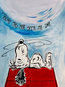 Snoopy cansado tumbado en su caseta con frase today has not been my day