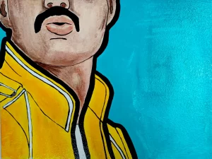 Cuadro inspirado en Freddie Mercury con chaqueta amarilla icónica sobre fondo azul turquesa en estilo pop art.
