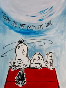 Snoopy agotado sobre su caseta roja con la frase Today Has Not Been My Day